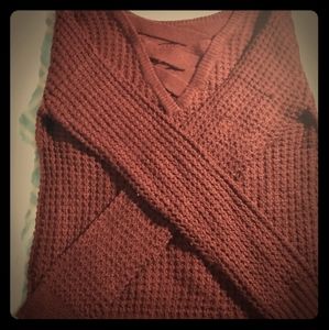 A mauve knitted sweater